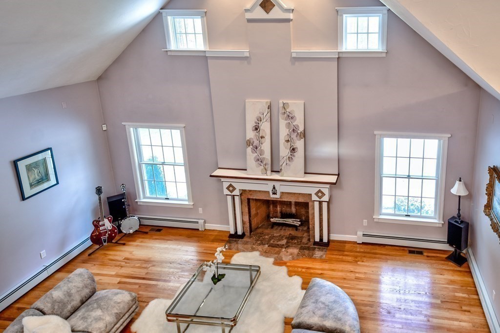 6 Barnbridge Circle Framingham, MA 01701 - Photo 10 of 41 a living room with furniture gym equipment and a fireplace