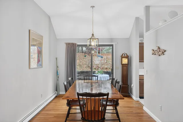 a view of a dining room with furniture window and wooden floor