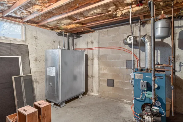 a view of a refrigerator in kitchen and utility room