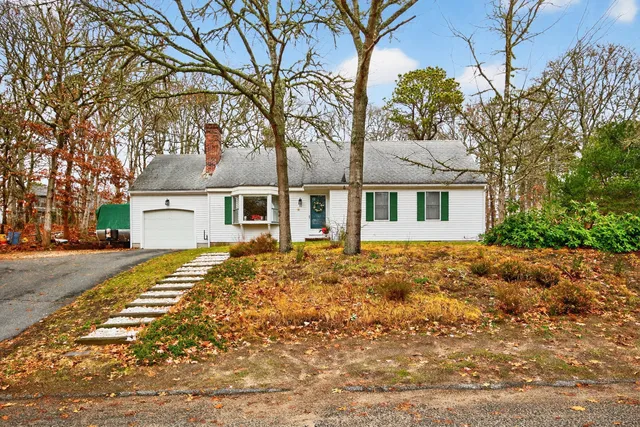 front view of a house with a trees
