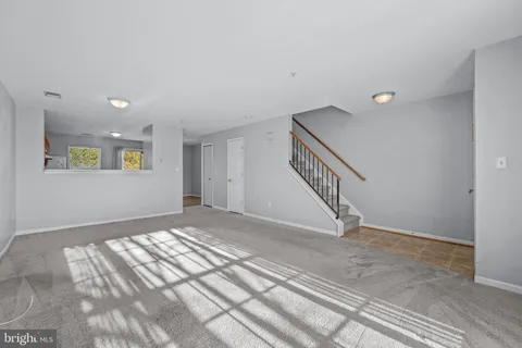 a view of an empty room with windows