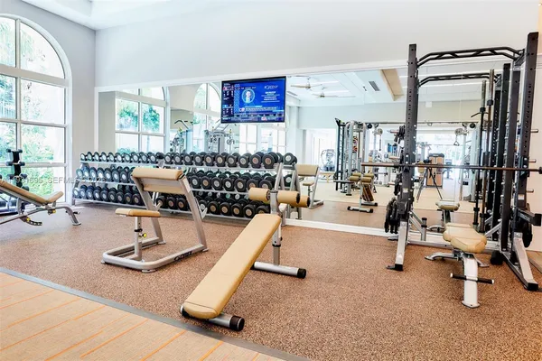 a living room with lots of gym equipment