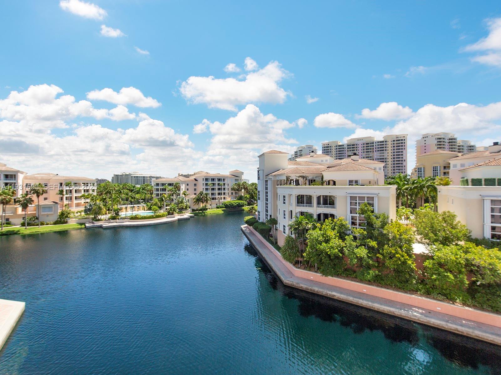 735 Crandon Boulevard, Unit 503 Key Biscayne, FL 33149 - Photo 3 of 3 a view of a lake with a building in the background