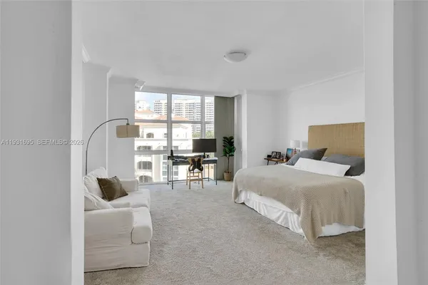 a bedroom with a bed and a couch