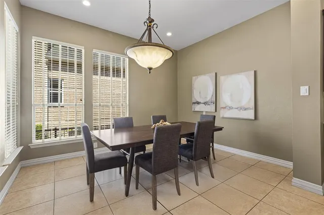 a view of a dining room with furniture wooden floor and chandelier