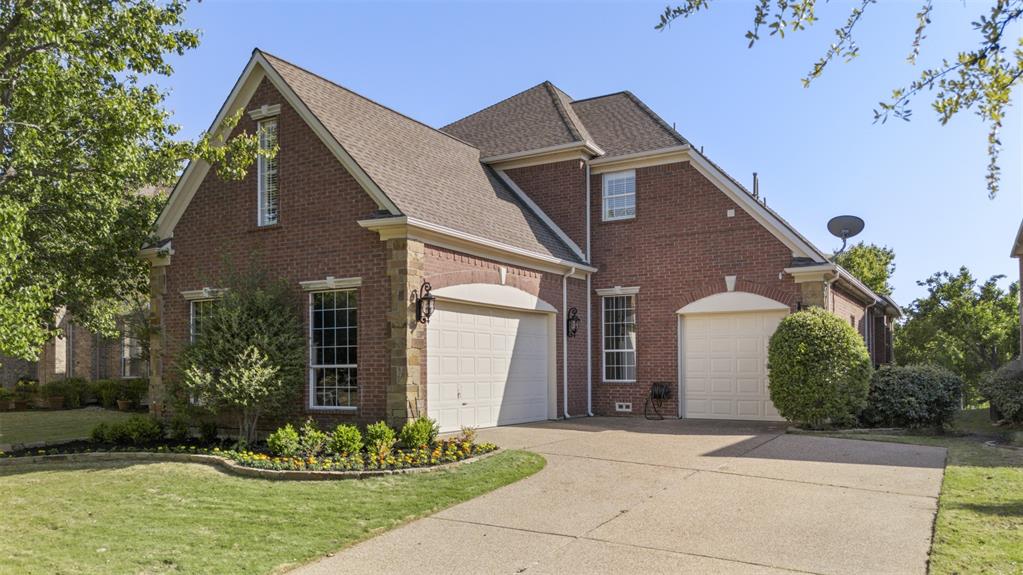 2070 Azalea Trail Irving, TX 75063 - Photo 2 of 36 a front view of a house with a garden