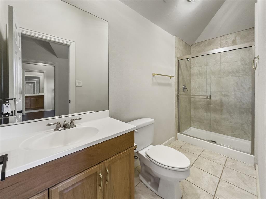 2070 Azalea Trail Irving, TX 75063 - Photo 24 of 36 a bathroom with a sink toilet and shower