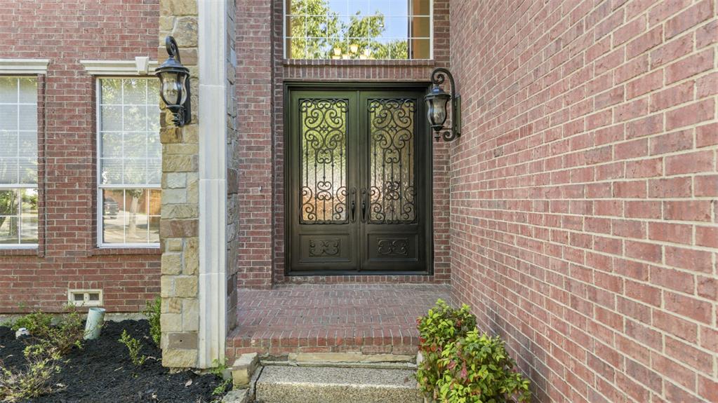 2070 Azalea Trail Irving, TX 75063 - Photo 3 of 36 a front view of a house with a garden