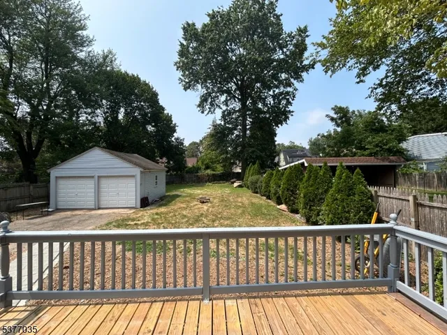 a view of wooden fence and trees