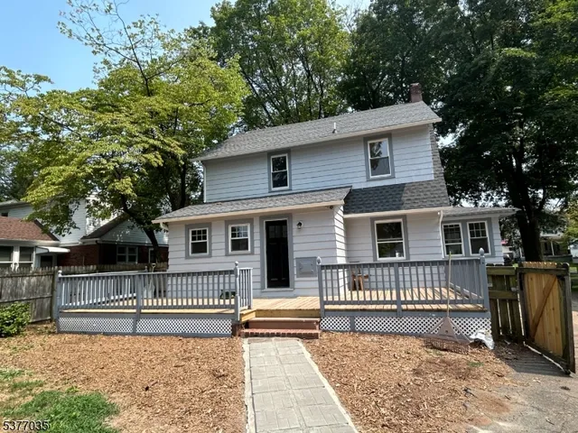 a backyard of a house with a deck