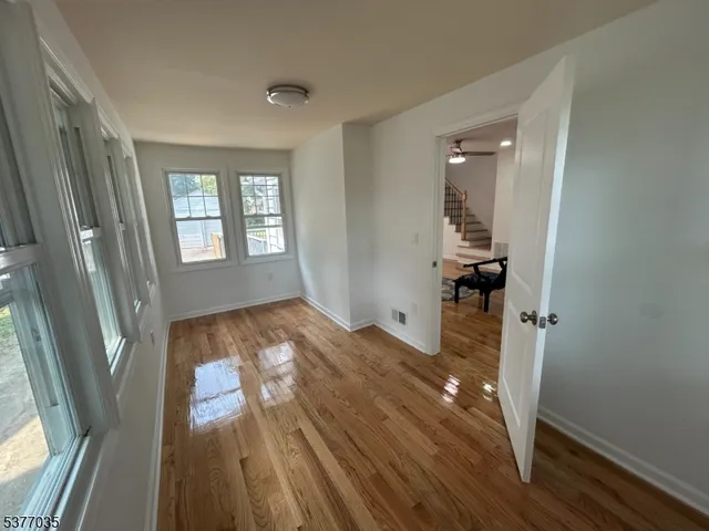 a view of entryway with wooden floor