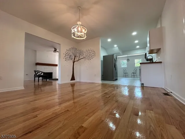 a view of kitchen and dining room with wooden floor