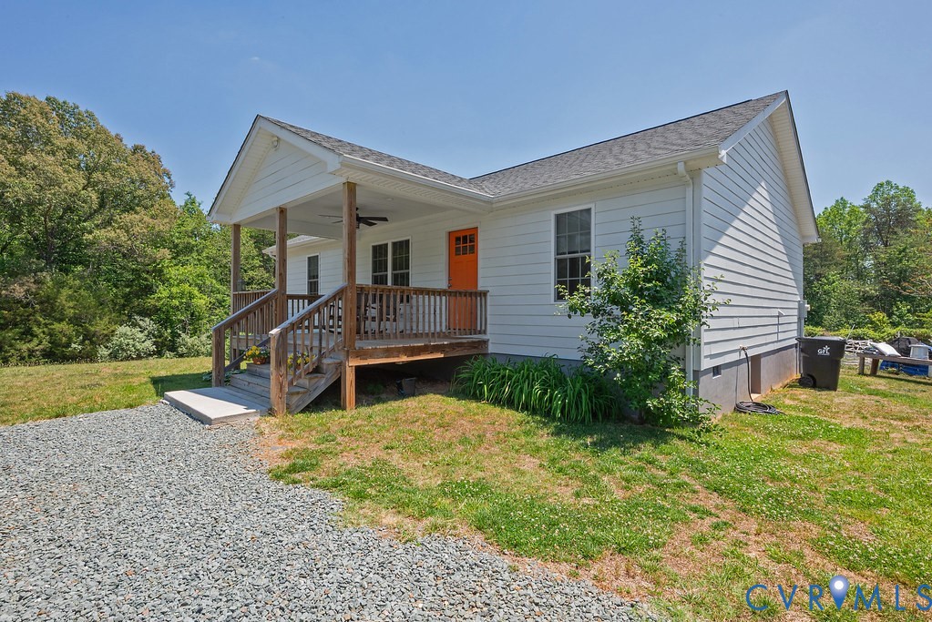 4336 Hells Bend Road Palmyra, VA 22963 - Photo 1 of 35 White siding exterior with a covered front porch f