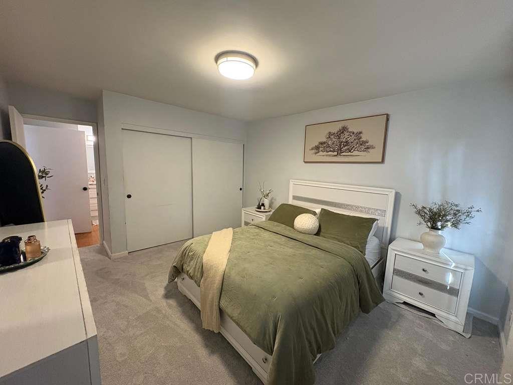 440 L Street, Unit J Chula Vista, CA 91911 - Photo 3 of 10 a bedroom with a bed and a couch