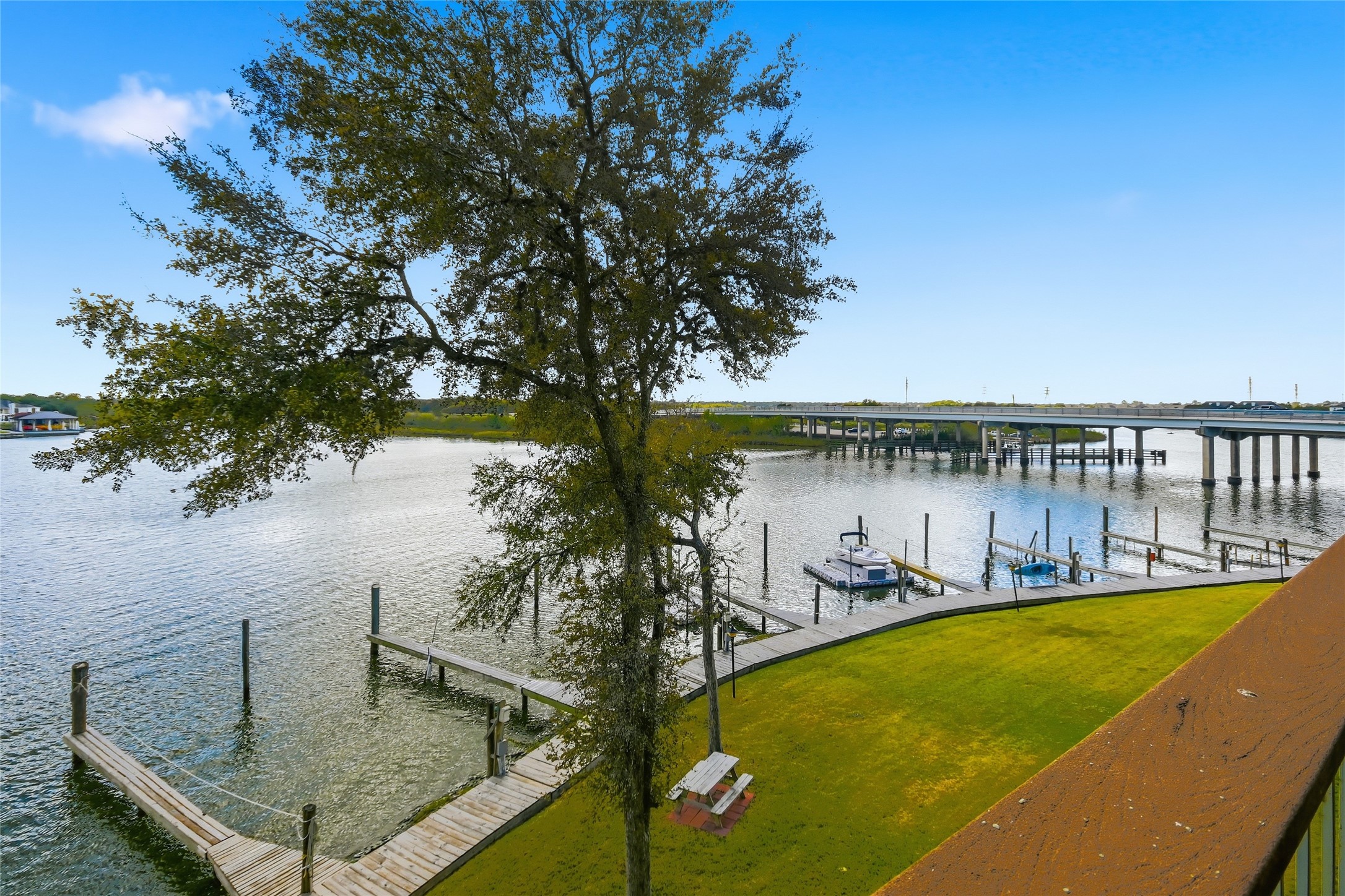 18809 Egret Bay Boulevard, Unit 112 Webster, TX 77058 - Photo 1 of 48 a view of a swimming pool with an outdoor seating and a yard