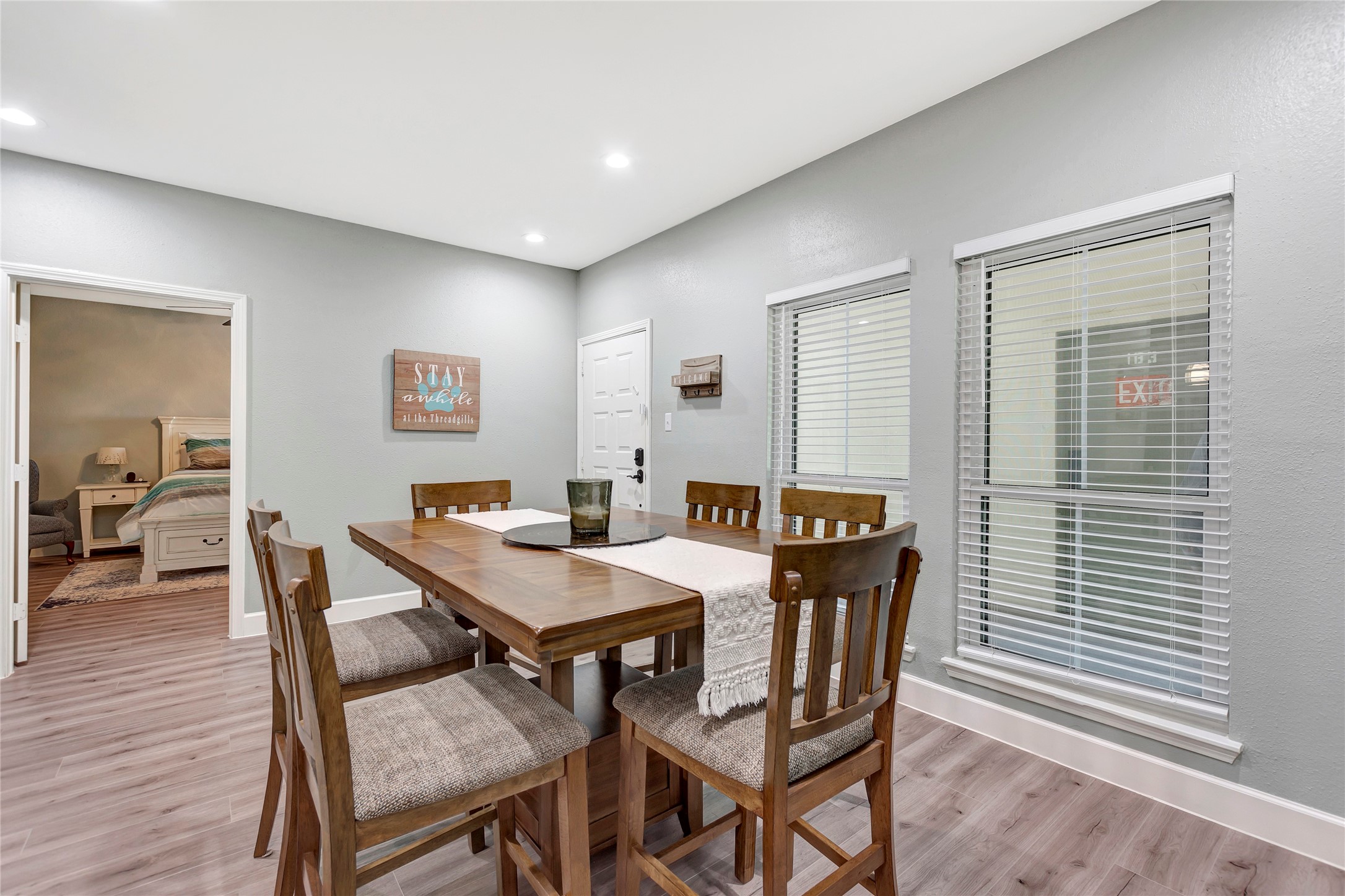 18809 Egret Bay Boulevard, Unit 112 Webster, TX 77058 - Photo 18 of 48 a view of a dining room with furniture and wooden floor