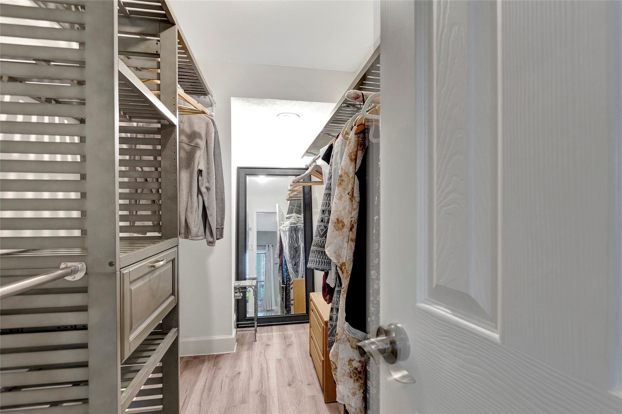 18809 Egret Bay Boulevard, Unit 112 Webster, TX 77058 - Photo 28 of 48 a view of hallway with stairs and wooden floor