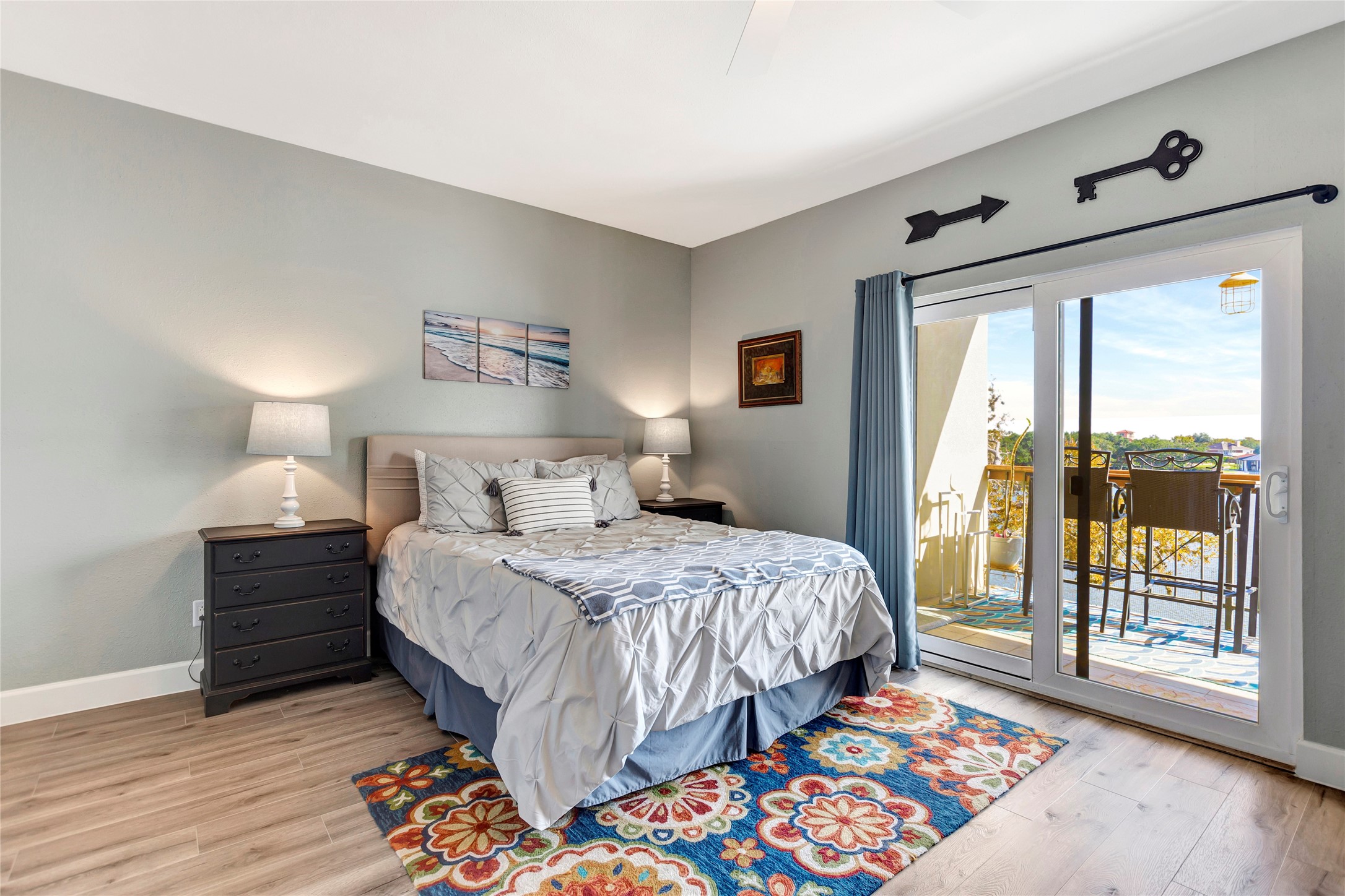 18809 Egret Bay Boulevard, Unit 112 Webster, TX 77058 - Photo 30 of 48 a bedroom with a bed and wooden floor