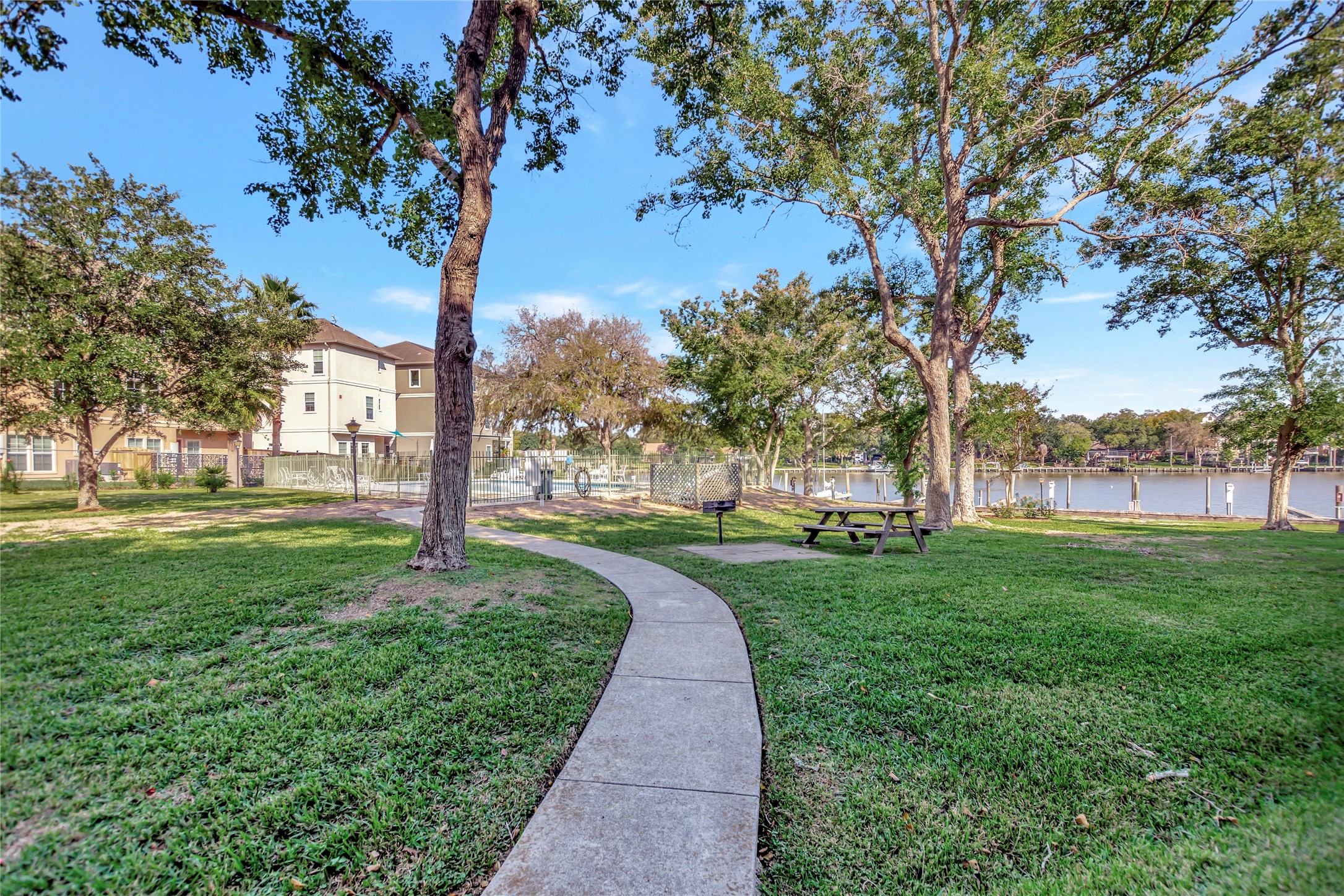 18809 Egret Bay Boulevard, Unit 112 Webster, TX 77058 - Photo 35 of 48 Community area has picnic tables, lots of trees, green space, and a place to enjoy the tranquil water views!