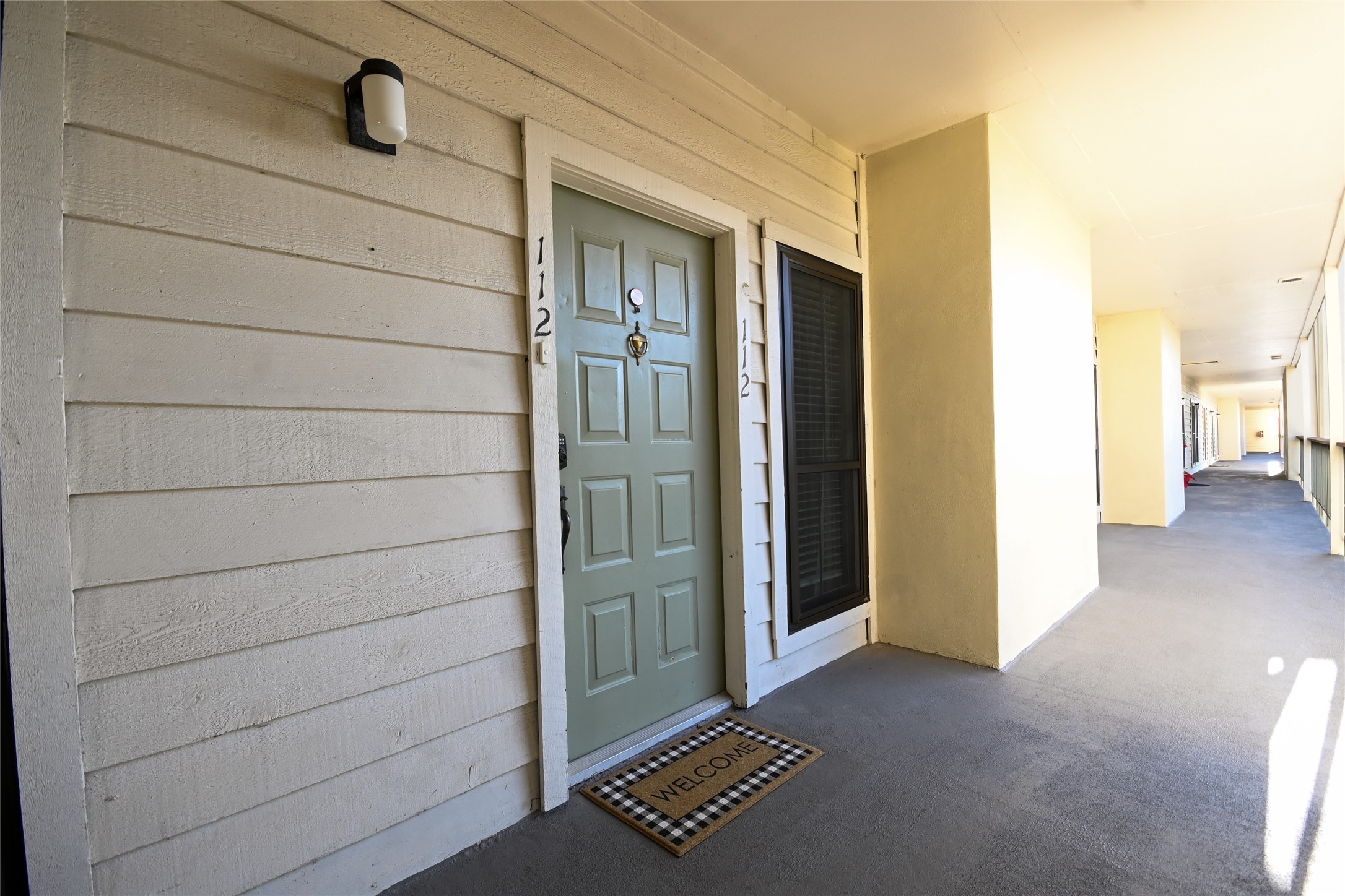 18809 Egret Bay Boulevard, Unit 112 Webster, TX 77058 - Photo 42 of 48 a view of front door with wooden floor