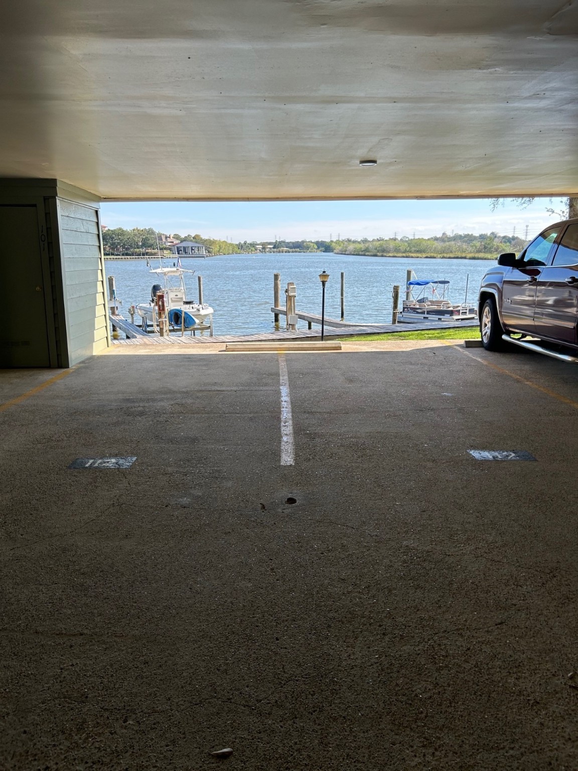18809 Egret Bay Boulevard, Unit 112 Webster, TX 77058 - Photo 47 of 48 Two (2) assigned covered carport parking spots under the building.