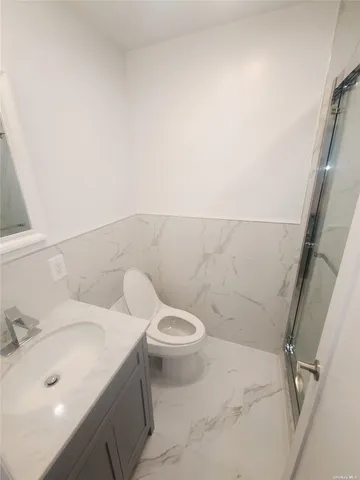 a bathroom with a sink and toilet