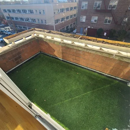 a view of a swimming pool with a yard