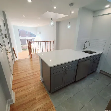 a room with a sink and a mirror