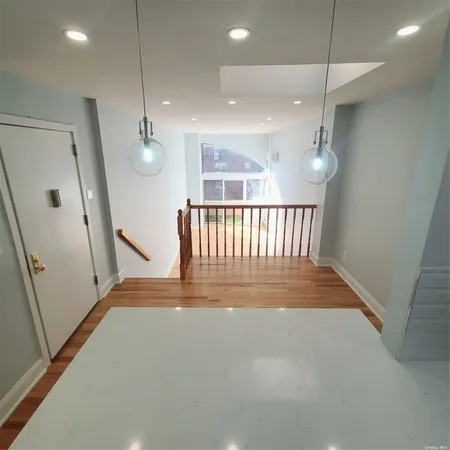 an entryway in a hall with a window