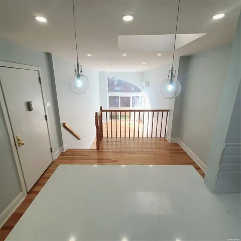 an entryway in a hall with a window