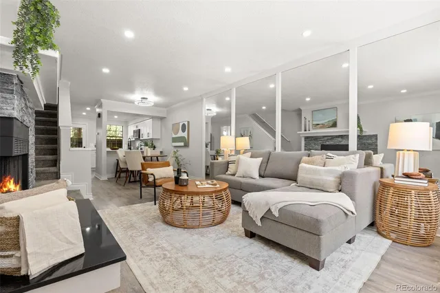 a living room with furniture and a lamp