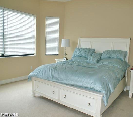 7414 Acorn Way Naples, FL 34119 - Photo 6 of 24 a living room with a bed and next to a window