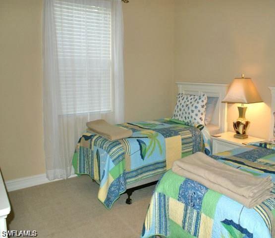 7414 Acorn Way Naples, FL 34119 - Photo 10 of 24 a bedroom with bed and a window