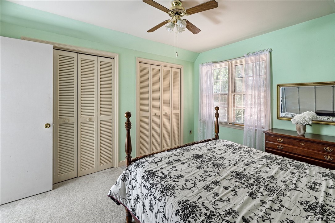12441 Spring Run Road Chesterfield, VA 23832 - Photo 17 of 28 a bedroom with a bed and a chandelier