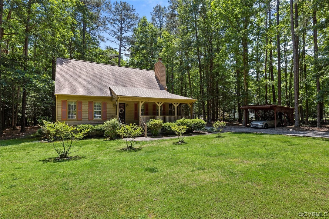 12441 Spring Run Road Chesterfield, VA 23832 - Photo 2 of 28 a front view of a house with garden and trees