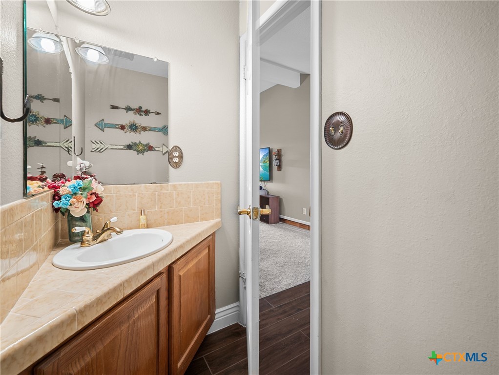 782 Santa Clara Loop Marion, TX 78124 - Photo 34 of 48 a bathroom with a sink and a mirror