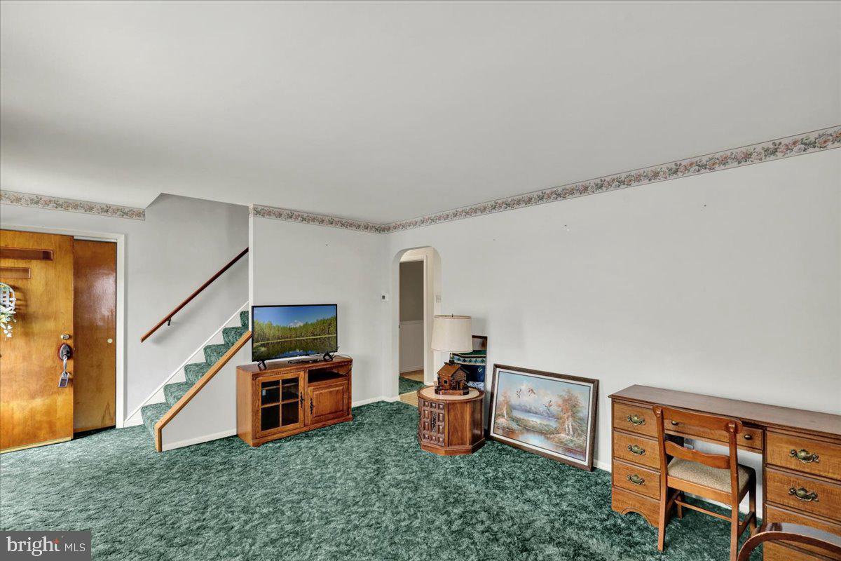 1224 Commonwealth Boulevard Reading, PA 19607 - Photo 8 of 27 a living room with furniture and a flat screen tv