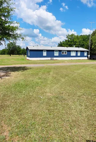 a view of a large pool with an ocean view