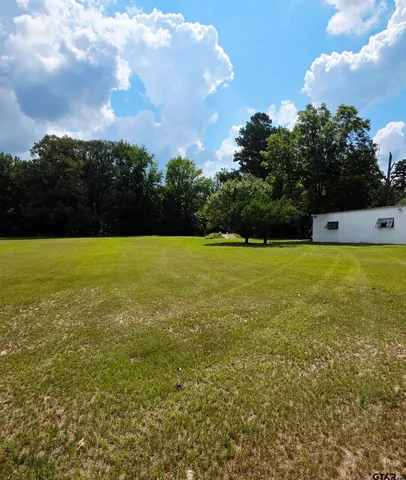 a view of a swimming pool and an outdoor space