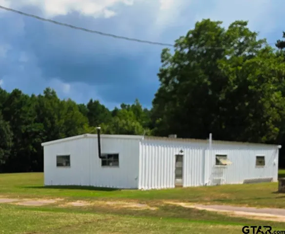 a view of a house with a swimming pool