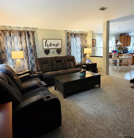 a living room with furniture and a couch