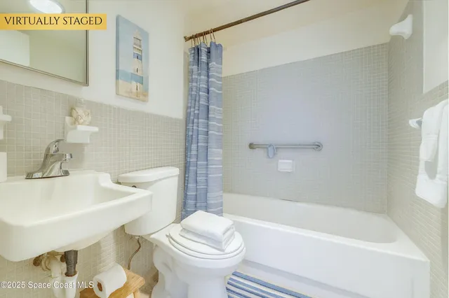 a bathroom with a sink toilet and bathtub