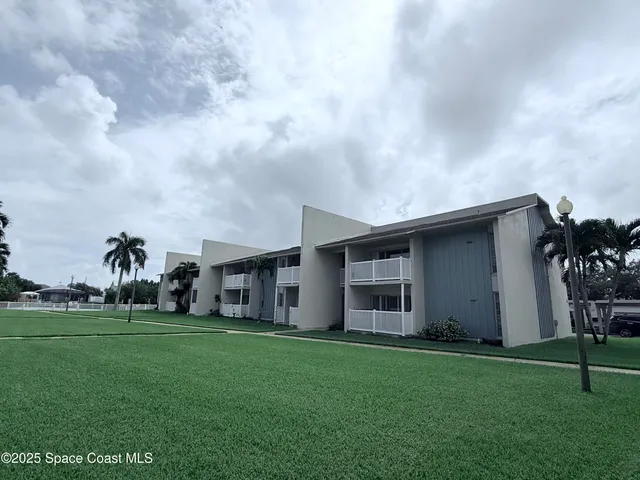 a view of house with yard