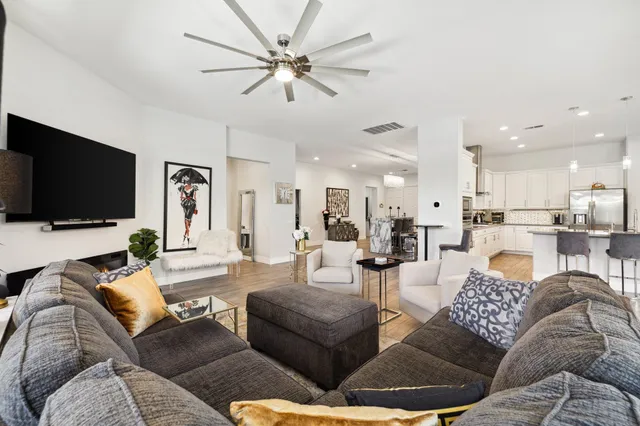 a kitchen with stainless steel appliances kitchen island granite countertop a sink and cabinets