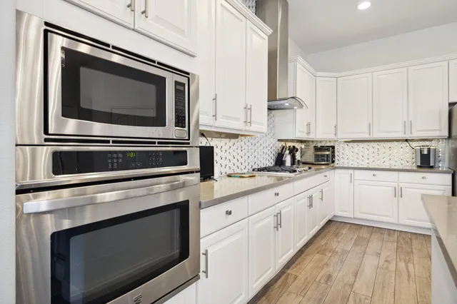 a kitchen with sink and cabinets