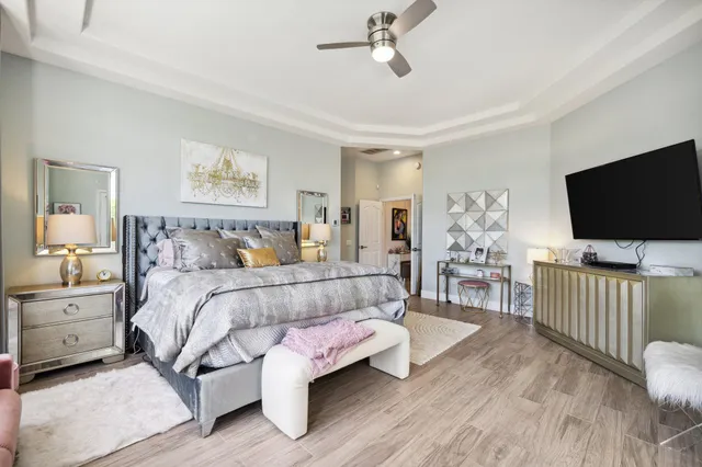 a spacious bathroom with a shower sink and mirror