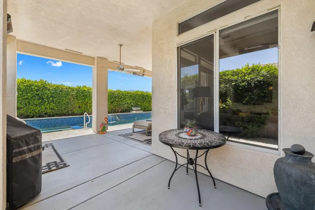 a view of a lush green hillside and houses