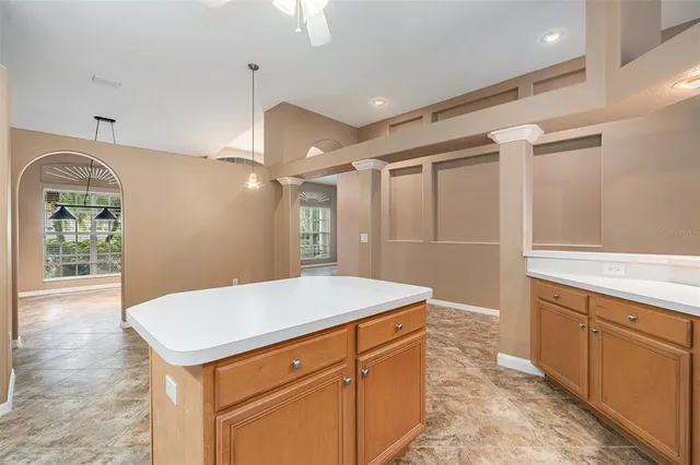 a room with a sink and a wooden floor