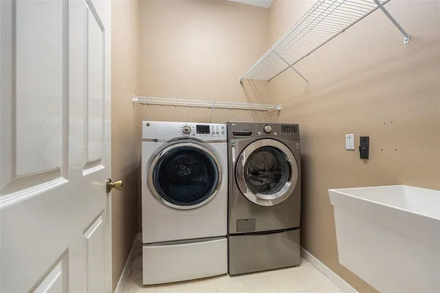a utility room with dryer and washer