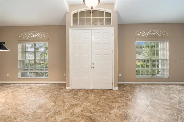 an empty room with windows